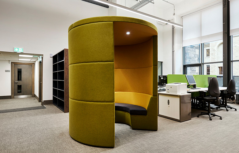 High sided office meeting booth with acoustic ceiling